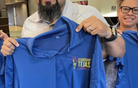 Arturo’s Class Shirt Design: Arturo proudly shows off the class shirts featuring his custom logo design.