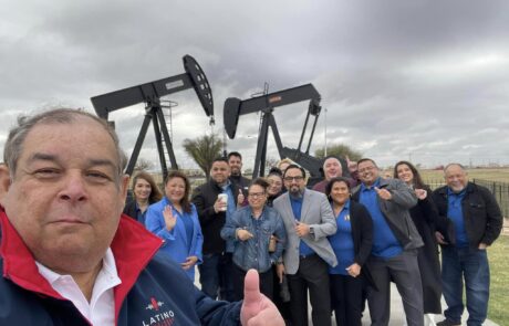 Midland Photo Op: The group captures a moment with Midland’s iconic oil drilling rigs in the background.
