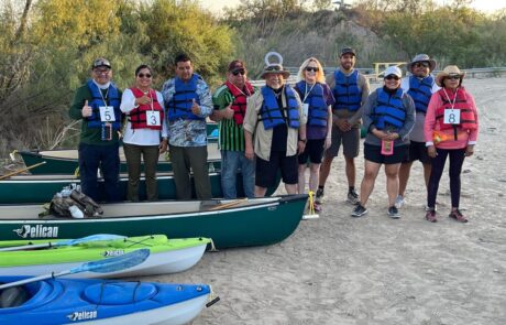 Leadership Tejas cohort poses before a five-hour canoe trip down the Rio Grande.